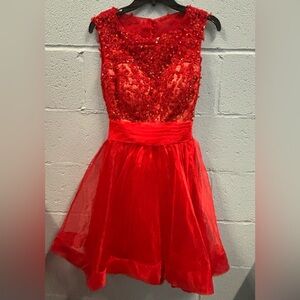 Red beaded top cocktail dress.no tags never worn.